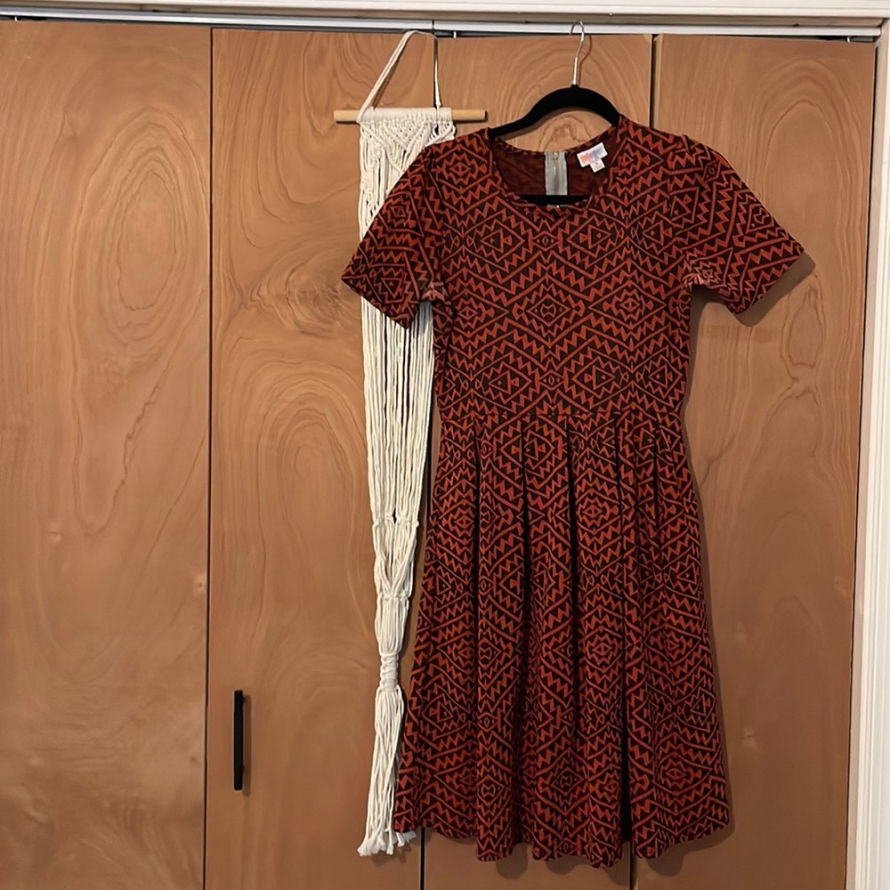 Medium lula roe dress. Well worn but in good shape. Note the deodorant marks.